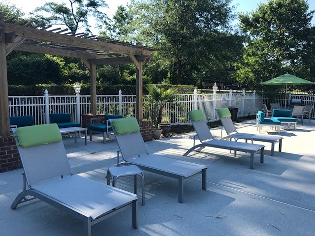 Sundeck with lounge chairs at the Crescent Commons Swimming Pool